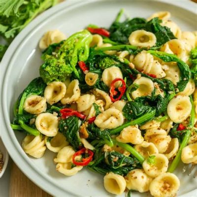 Orecchiette con Cime di Rapa - Savor the Ear-Shaped Pasta Bathed in Luscious Bitter Greens and Creamy Ricotta!